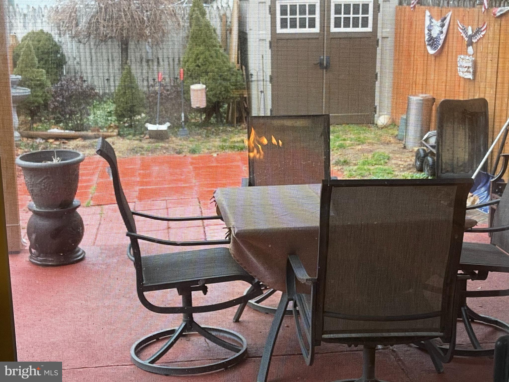 12014 Tyrone Road Philadelphia, PA 19154 - Photo 29 of 32 a backyard of a house with table and chairs