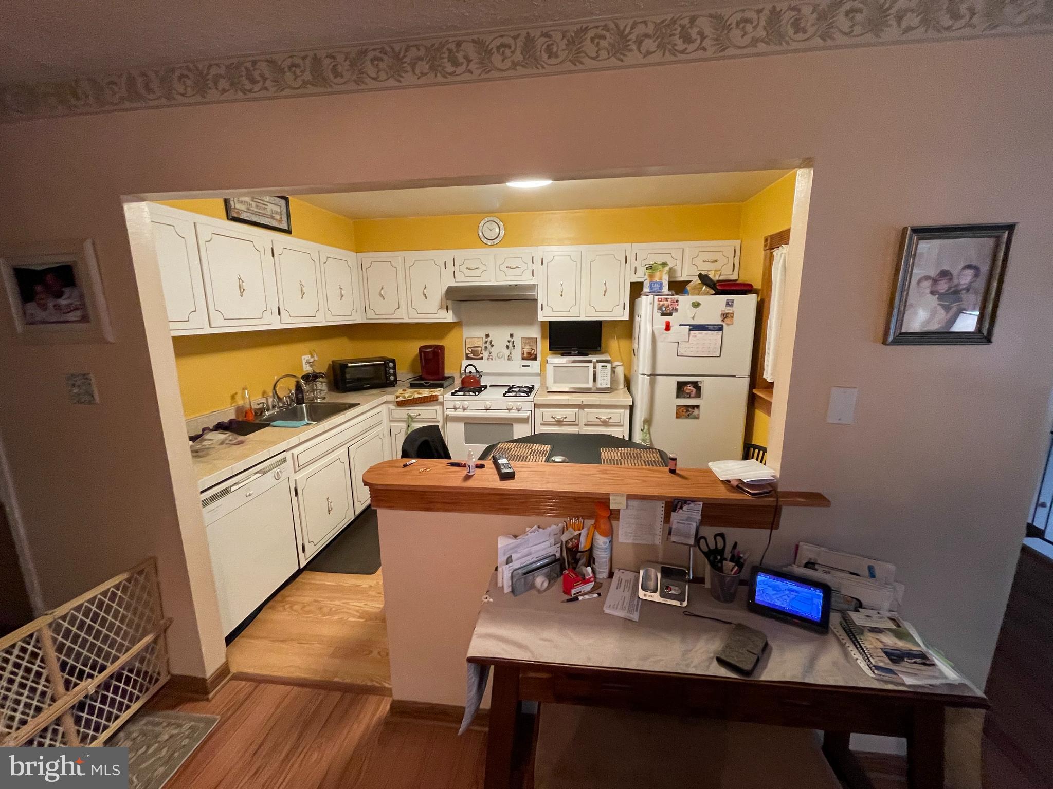 12014 Tyrone Road Philadelphia, PA 19154 - Photo 7 of 32 a kitchen with stainless steel appliances a stove a sink and a refrigerator