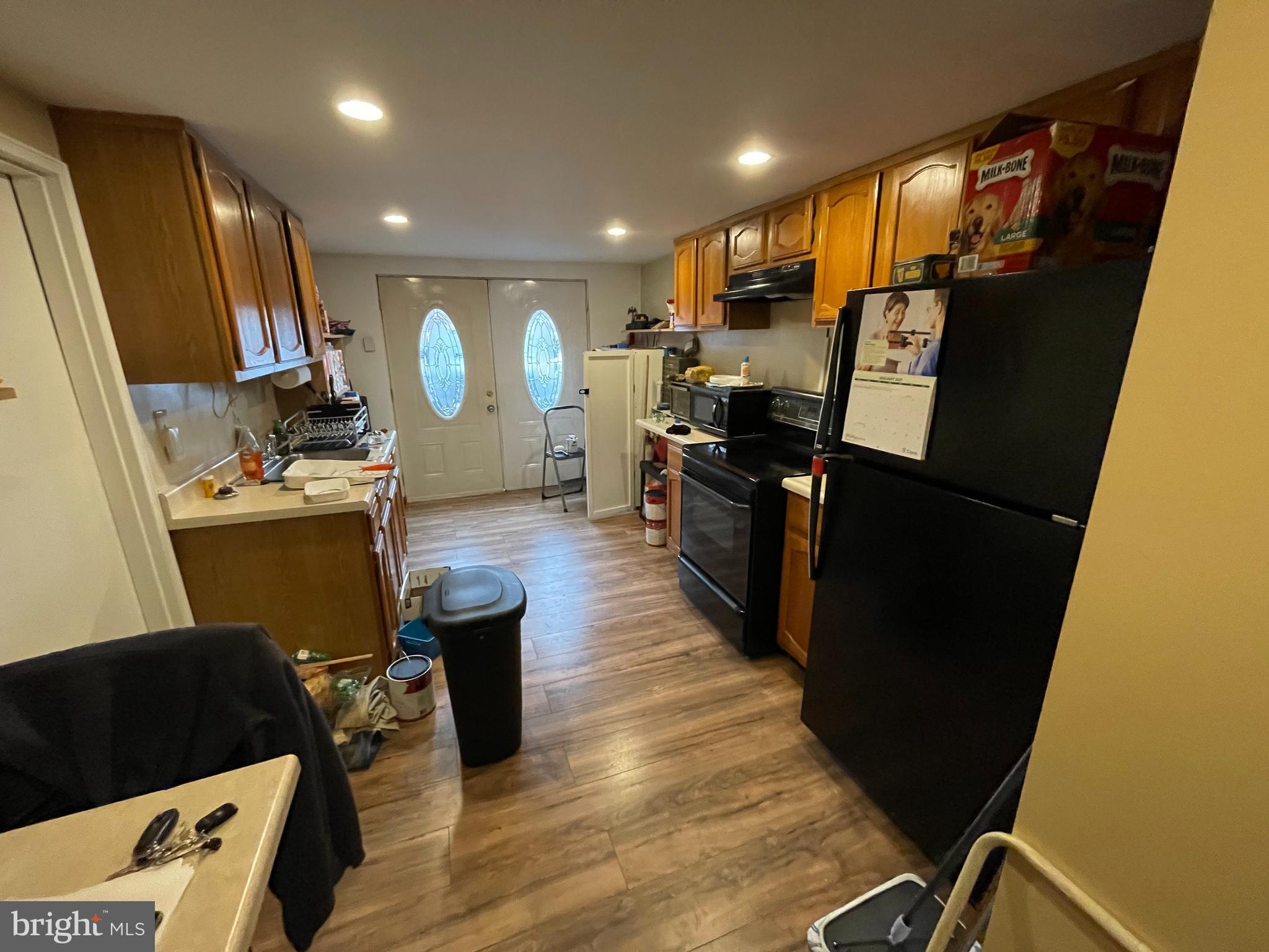12014 Tyrone Road Philadelphia, PA 19154 - Photo 8 of 32 a kitchen with stainless steel appliances a refrigerator a sink a stove and cabinets
