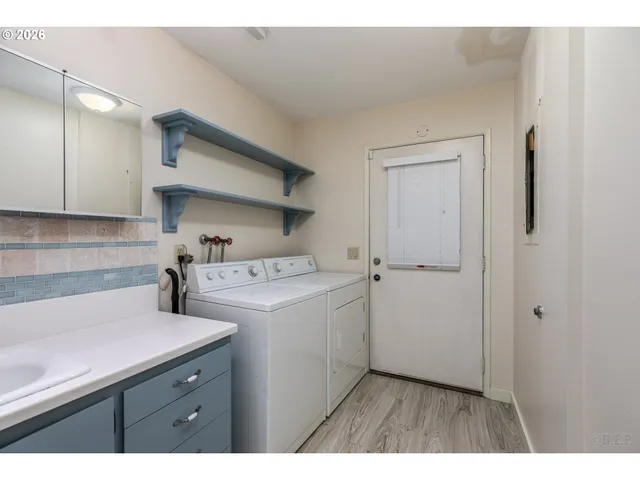 a view of storage and utility room with a sink