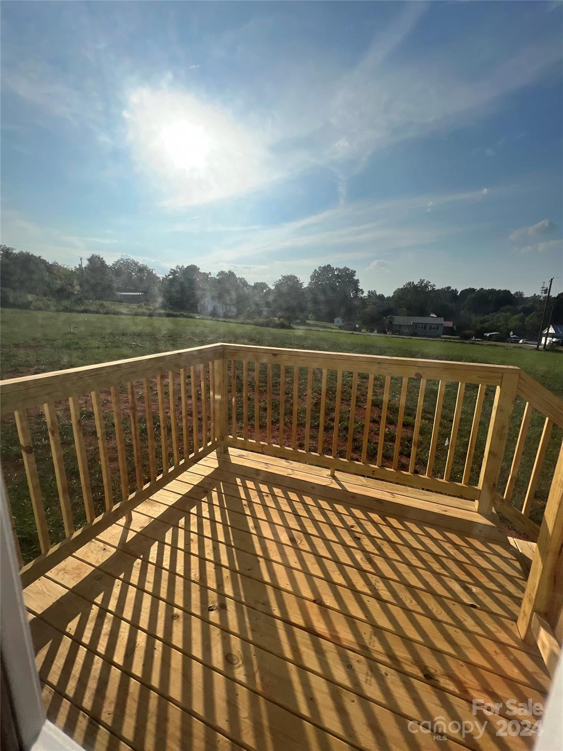 133 Calhoun Road, Unit 2 Stony Point, NC 28678 - Photo 2 of 24 a view of balcony with wooden floor and lake view