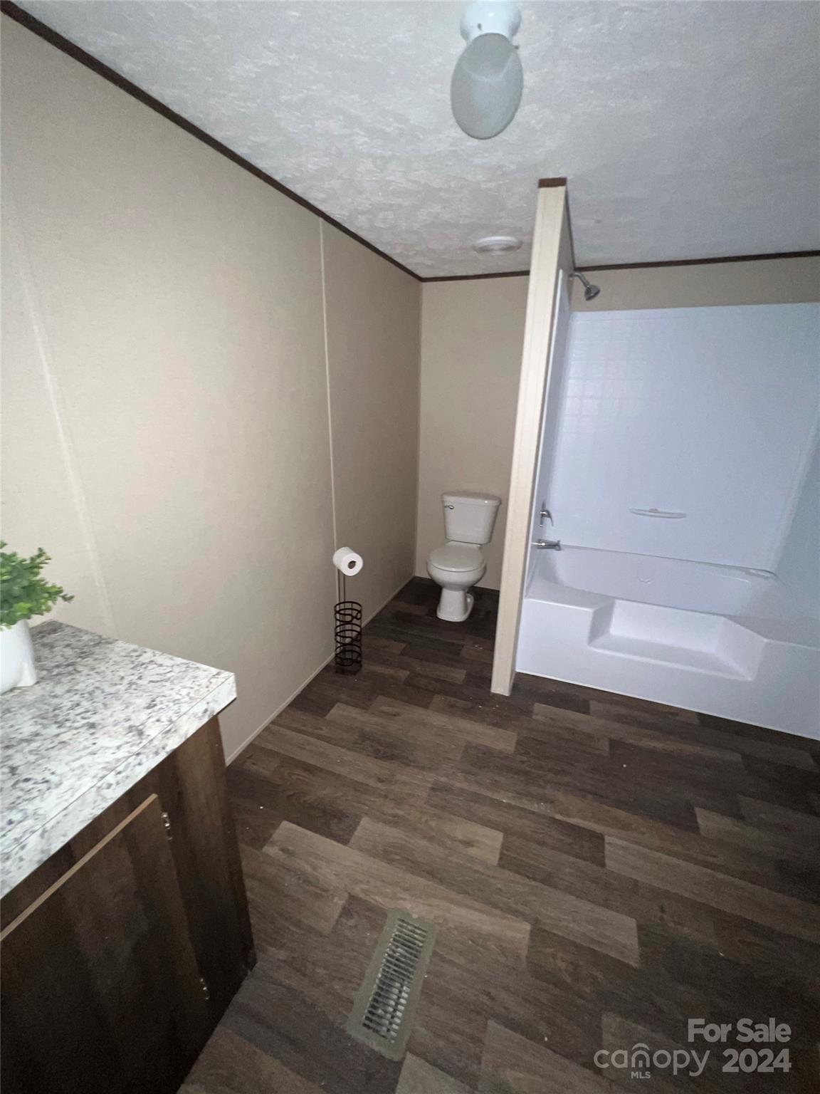 133 Calhoun Road, Unit 2 Stony Point, NC 28678 - Photo 23 of 24 a view of entryway and hall with wooden floor