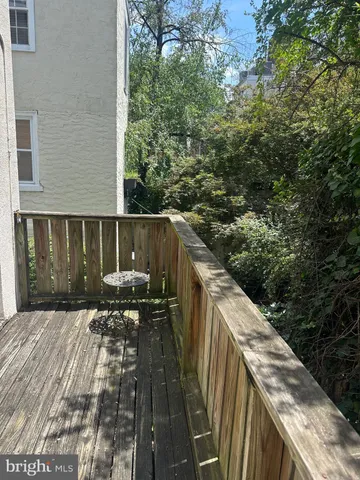 a balcony with wooden floor