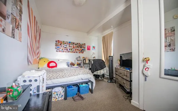 a bedroom with furniture and a bed