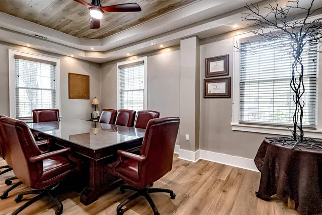 a view of a livingroom with furniture and a window