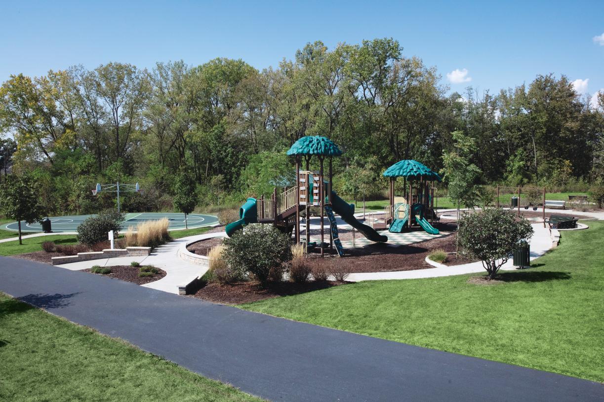 3547 Doral Drive Elgin, IL 60124 - Photo 8 of 9 a view of a park with large trees