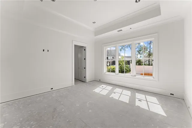 a view of an empty room with a window
