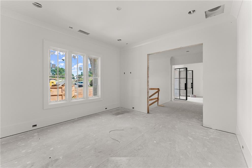 5071 Kings Cl Alpharetta, GA 30004 - Photo 19 of 53 a view of an empty room with a window