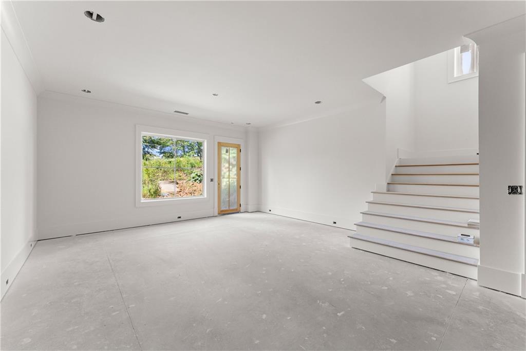 5071 Kings Cl Alpharetta, GA 30004 - Photo 26 of 53 an empty room with windows and plants