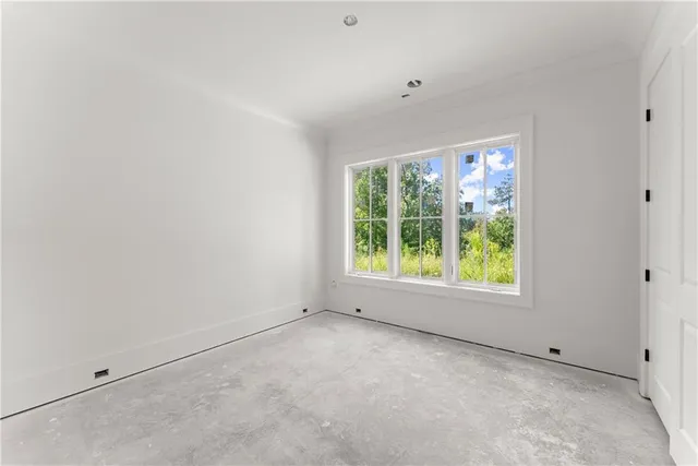 a house with snow on the side of road