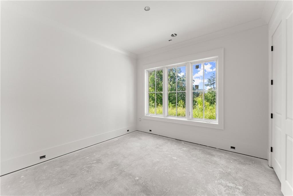 5071 Kings Cl Alpharetta, GA 30004 - Photo 27 of 53 a view of an empty room with a window