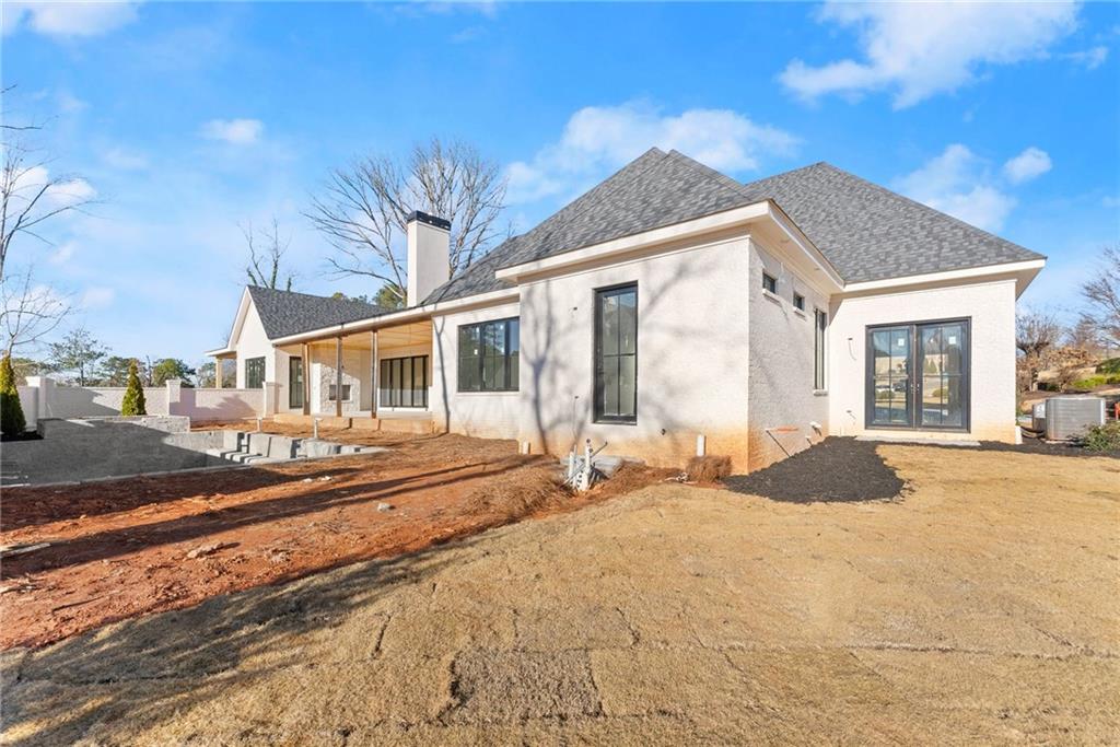 5071 Kings Cl Alpharetta, GA 30004 - Photo 30 of 53 a front view of a house with a yard