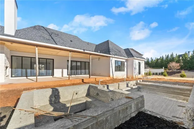 an aerial view of residential house with outdoor space and swimming pool