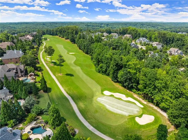 an aerial view of a house with a ocean view
