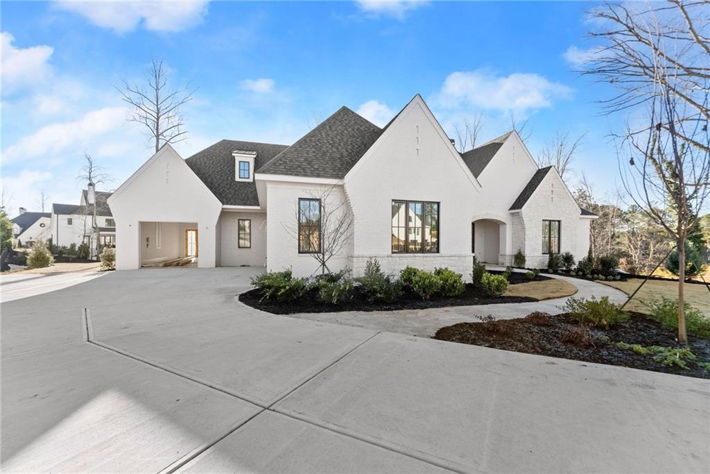 5071 Kings Cl Alpharetta, GA 30004 - Photo 4 of 53 a view of house with yard and green space