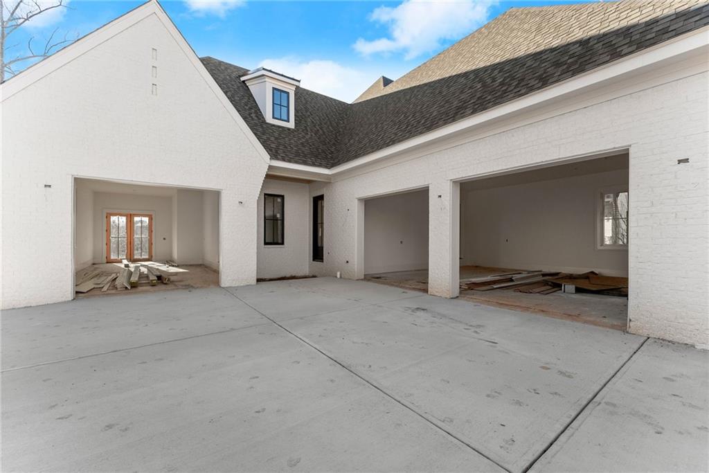 5071 Kings Cl Alpharetta, GA 30004 - Photo 6 of 53 a view of a house with a patio