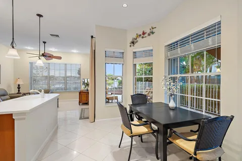 a view of a dining room with furniture window and outside view