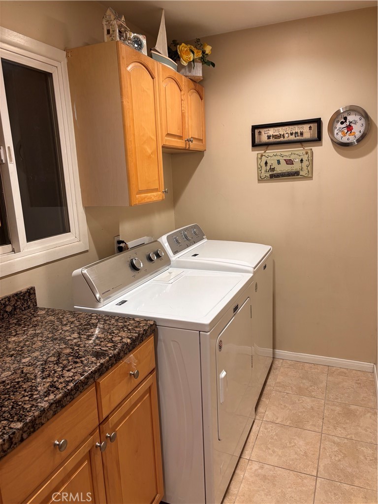 5604 Tower Road Riverside, CA 92506 - Photo 16 of 54 a utility room with a sink a washer and dryer