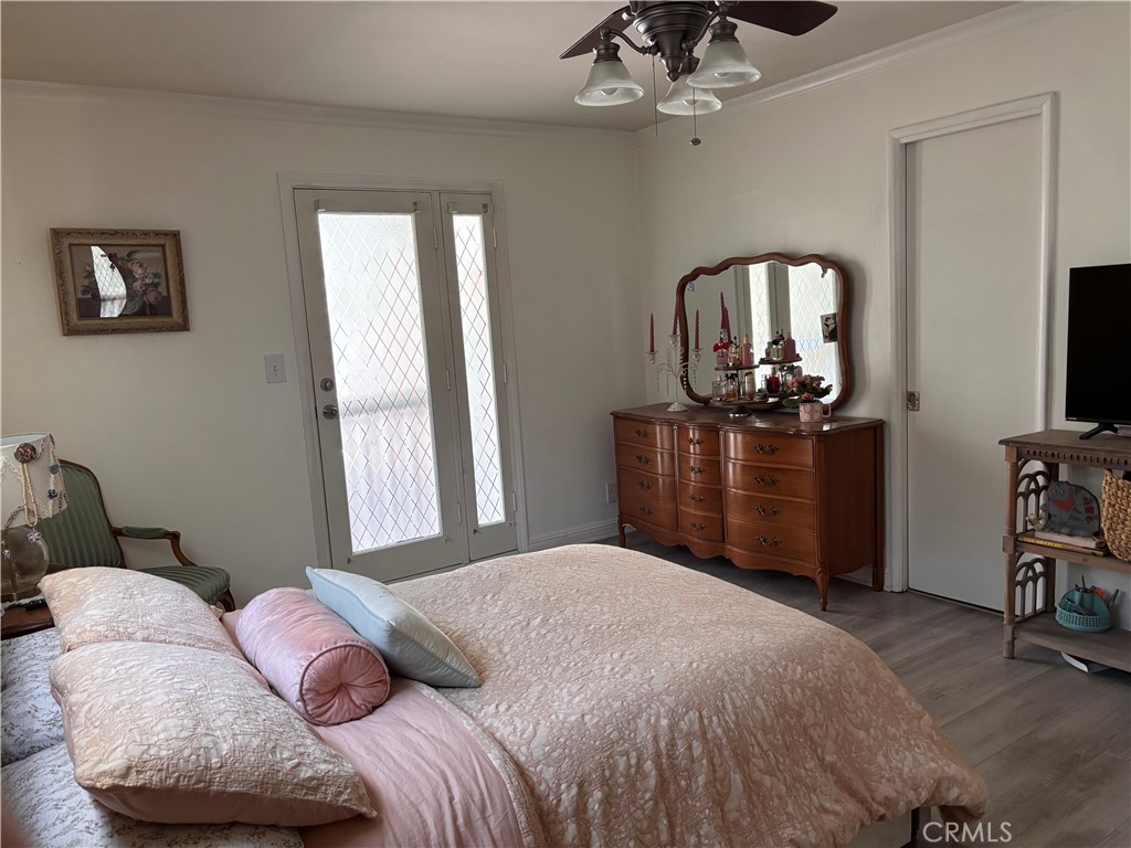 5604 Tower Road Riverside, CA 92506 - Photo 18 of 54 a bedroom with a bed and dresser with mirror