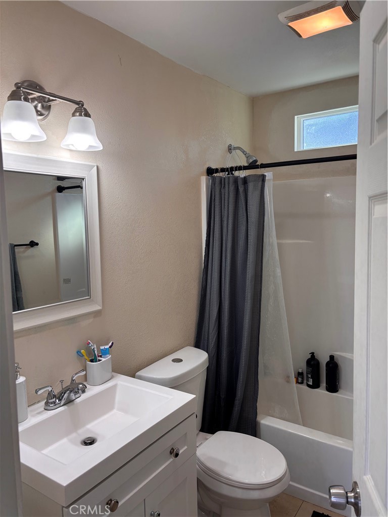 5604 Tower Road Riverside, CA 92506 - Photo 42 of 54 a bathroom with a sink toilet and shower