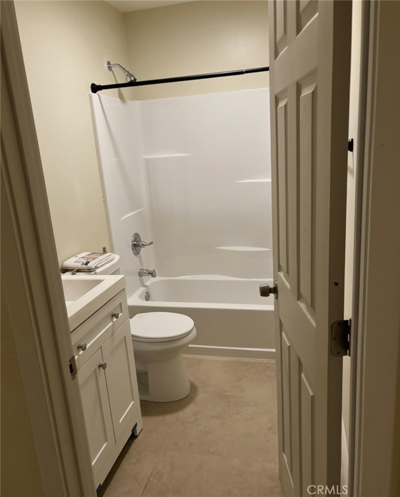 5604 Tower Road Riverside, CA 92506 - Photo 47 of 54 a bathroom with a granite countertop sink toilet and shower