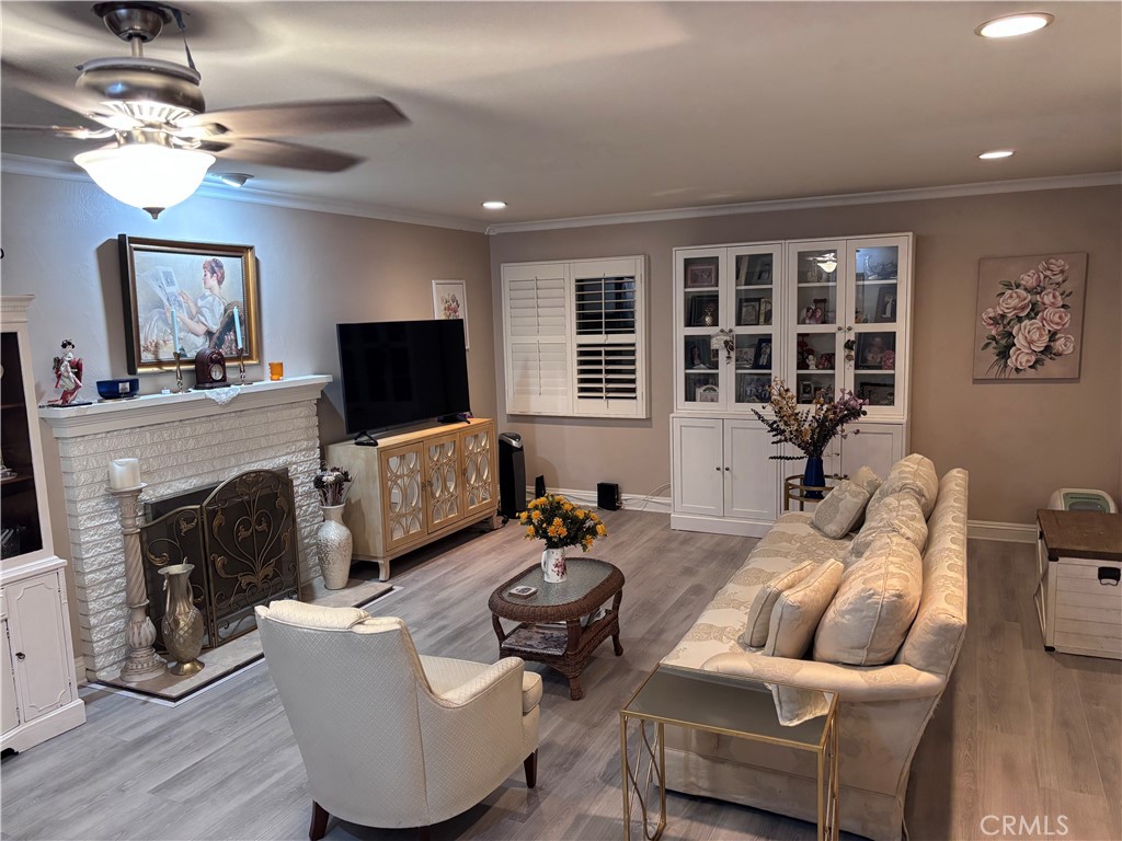 5604 Tower Road Riverside, CA 92506 - Photo 5 of 54 a living room with furniture a fireplace and a flat screen tv