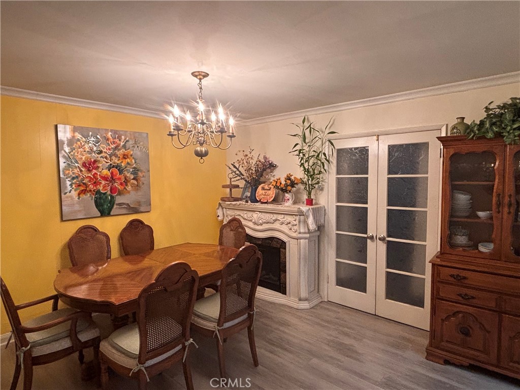 5604 Tower Road Riverside, CA 92506 - Photo 9 of 54 a dining room with furniture and wooden floor