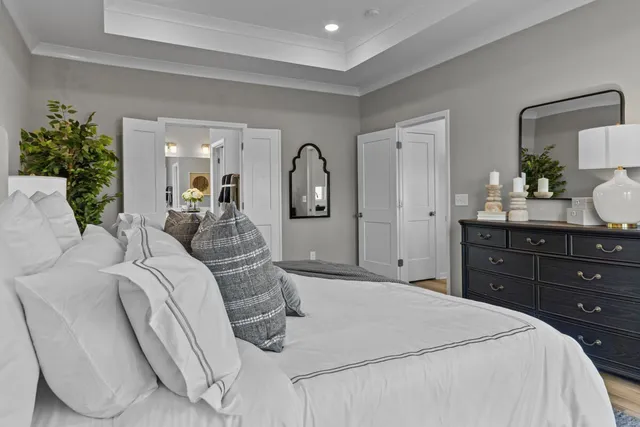 a bed room with a bed and a dresser