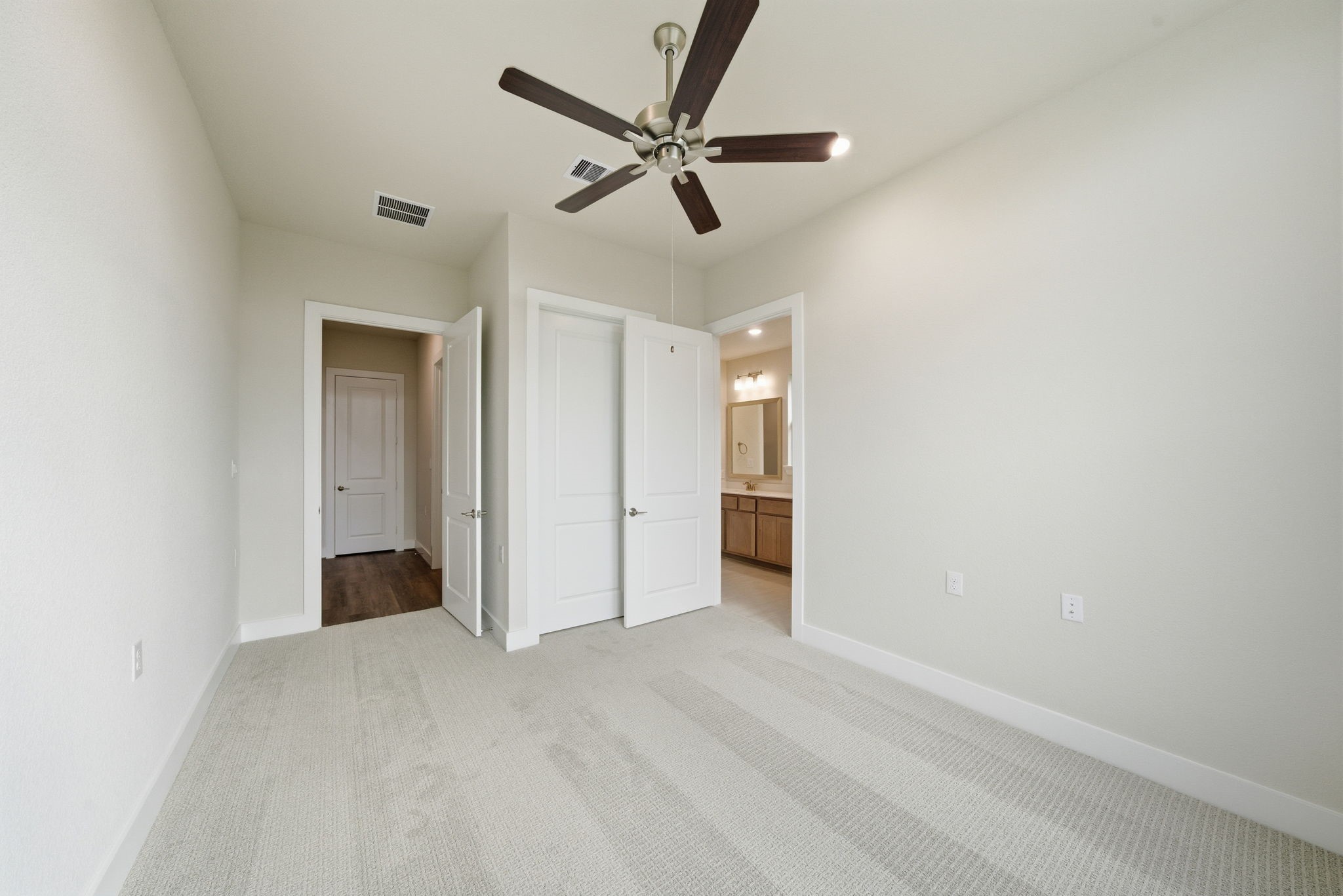 10026 Larkin Cove Willis, TX 77318 - Photo 21 of 46 a view of a livingroom with a ceiling fan and a ceiling fan