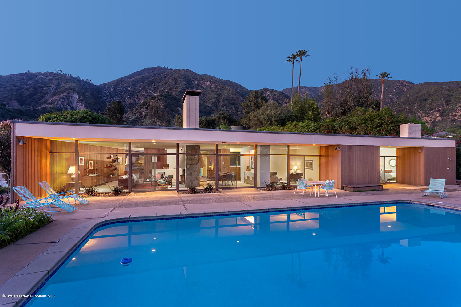 a view of a swimming pool with a patio