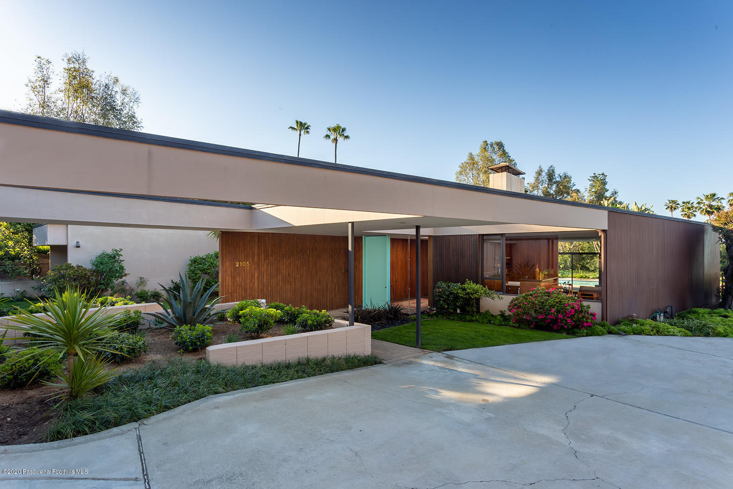 2105 Villa Heights Road Pasadena, CA 91107 - Photo 43 of 45 a view of a house with potted plants and a large tree