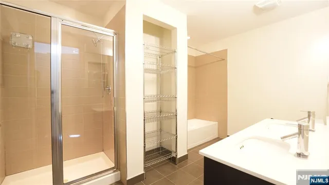 a bathroom with a bathtub and a sink