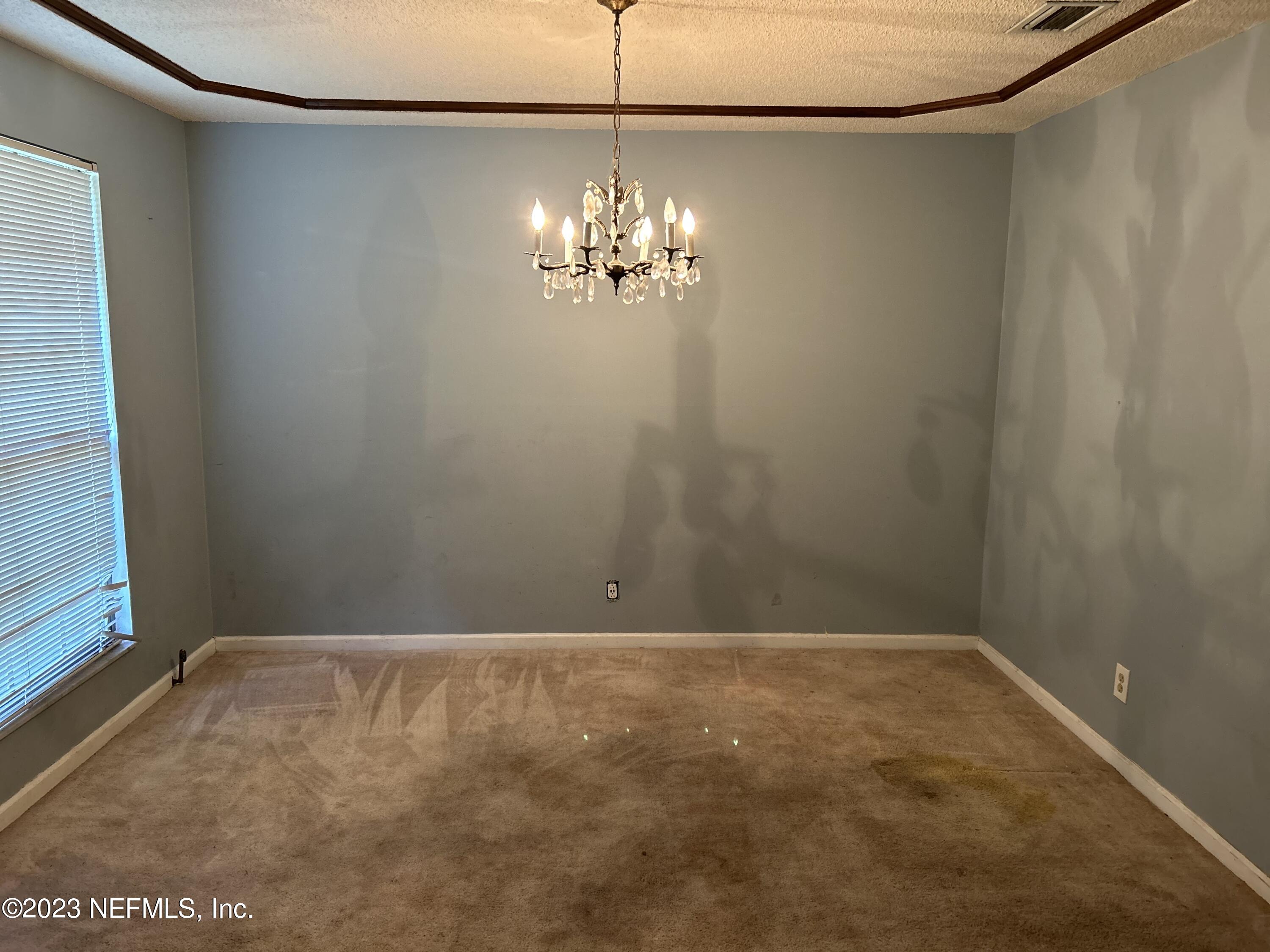 3733 Spring Lake Road Jacksonville, FL 32210 - Photo 2 of 7 a view of an empty room