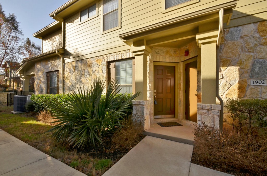 14815 Avery Ranch Boulevard, Unit 1902 Austin, TX 78717 - Photo 1 of 1 a view of a front door of the house and tree
