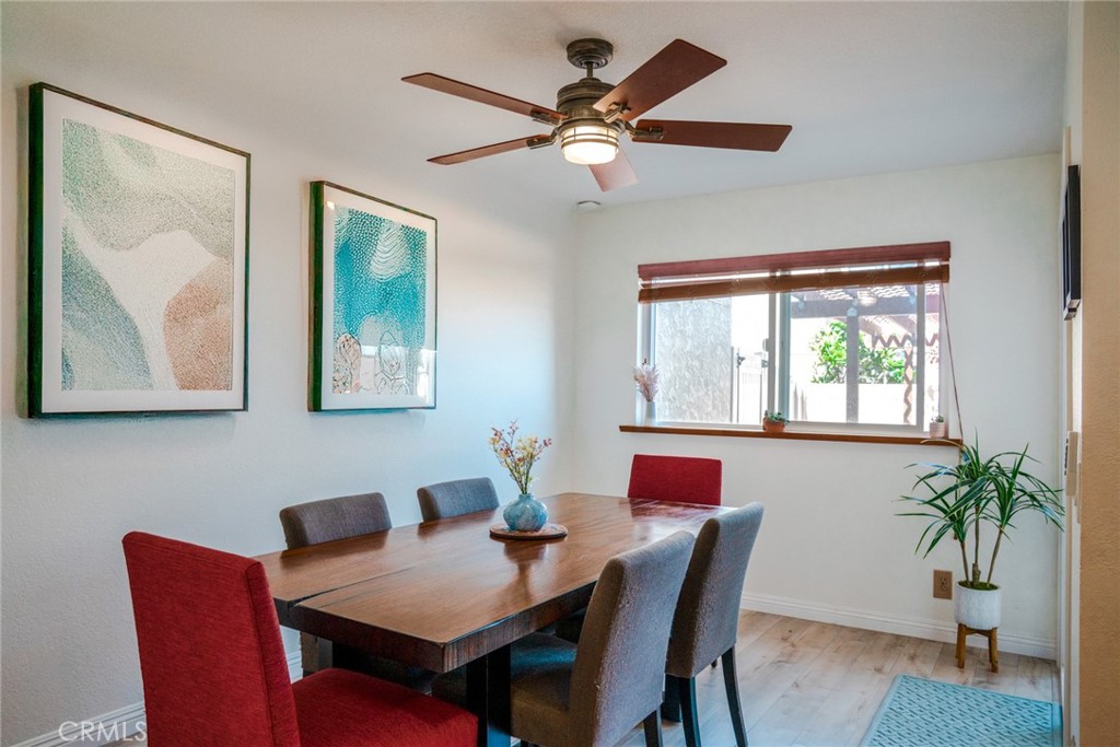 54 Oval Road, Unit 3 Irvine, CA 92604 - Photo 11 of 36 a view of a dining room with furniture window and outside view