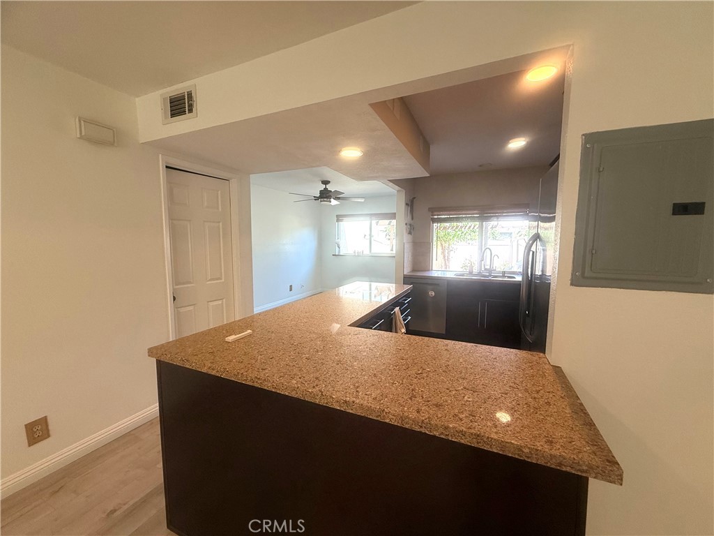 54 Oval Road, Unit 3 Irvine, CA 92604 - Photo 12 of 36 a living room with hard wood flooring