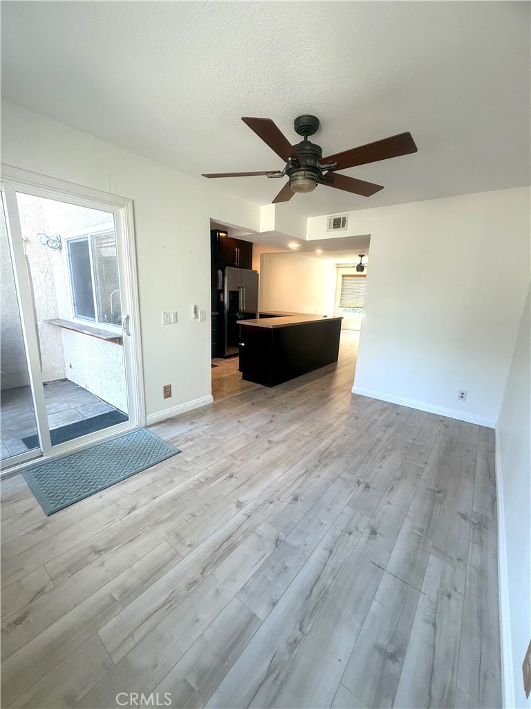 54 Oval Road, Unit 3 Irvine, CA 92604 - Photo 13 of 36 en empty room with wooden floor and windows