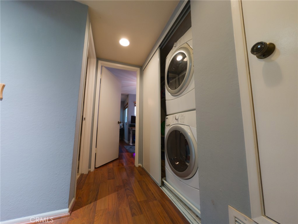 54 Oval Road, Unit 3 Irvine, CA 92604 - Photo 15 of 36 a view of a hallway with washer and dryer
