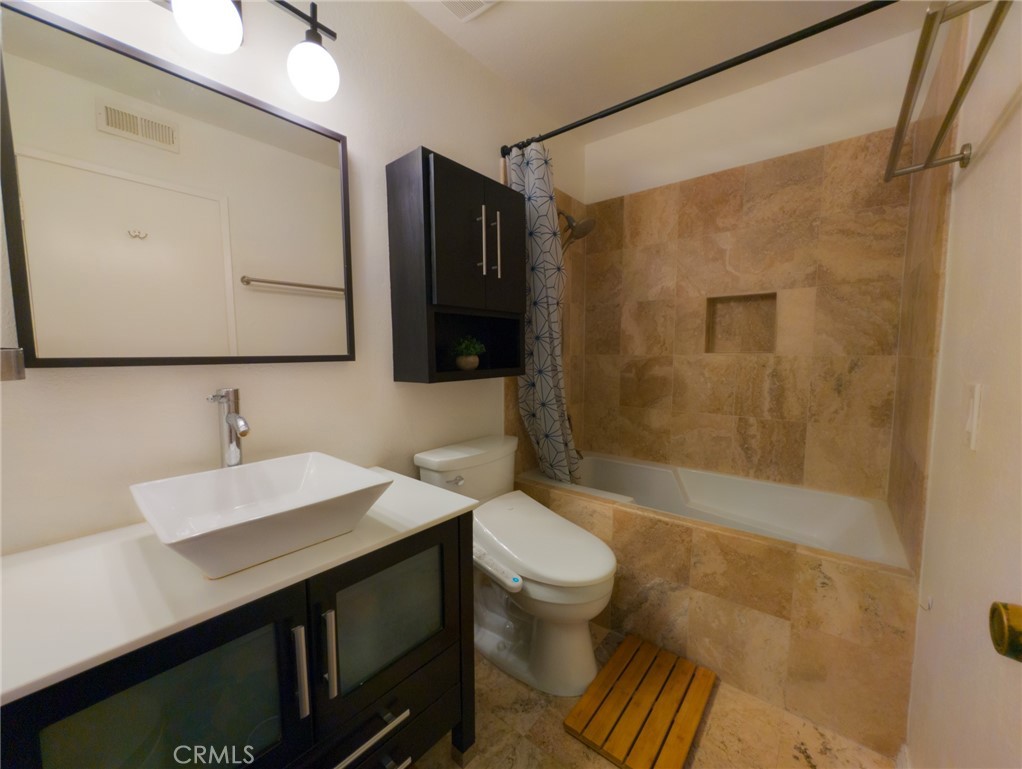 54 Oval Road, Unit 3 Irvine, CA 92604 - Photo 16 of 36 a bathroom with a sink a toilet and shower
