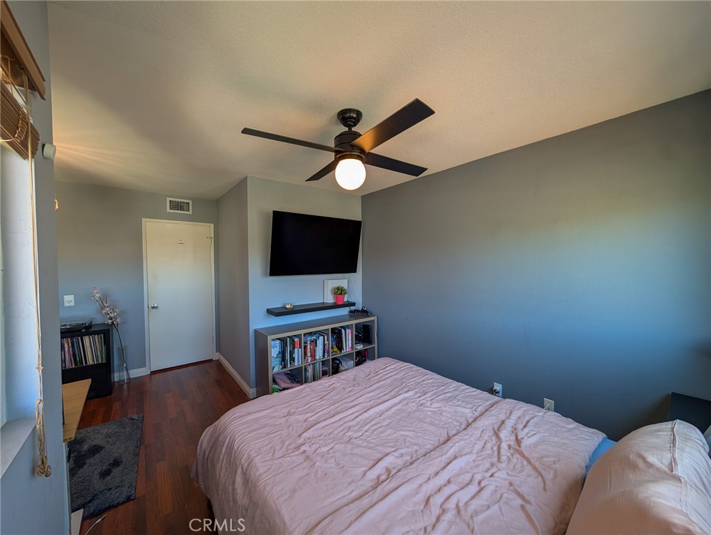 54 Oval Road, Unit 3 Irvine, CA 92604 - Photo 22 of 36 a bedroom with a bed and a flat screen tv