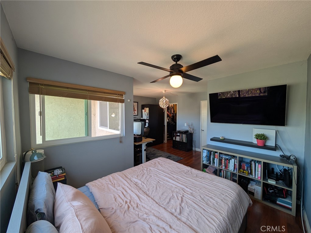 54 Oval Road, Unit 3 Irvine, CA 92604 - Photo 23 of 36 a bedroom with a bed and a flat screen tv
