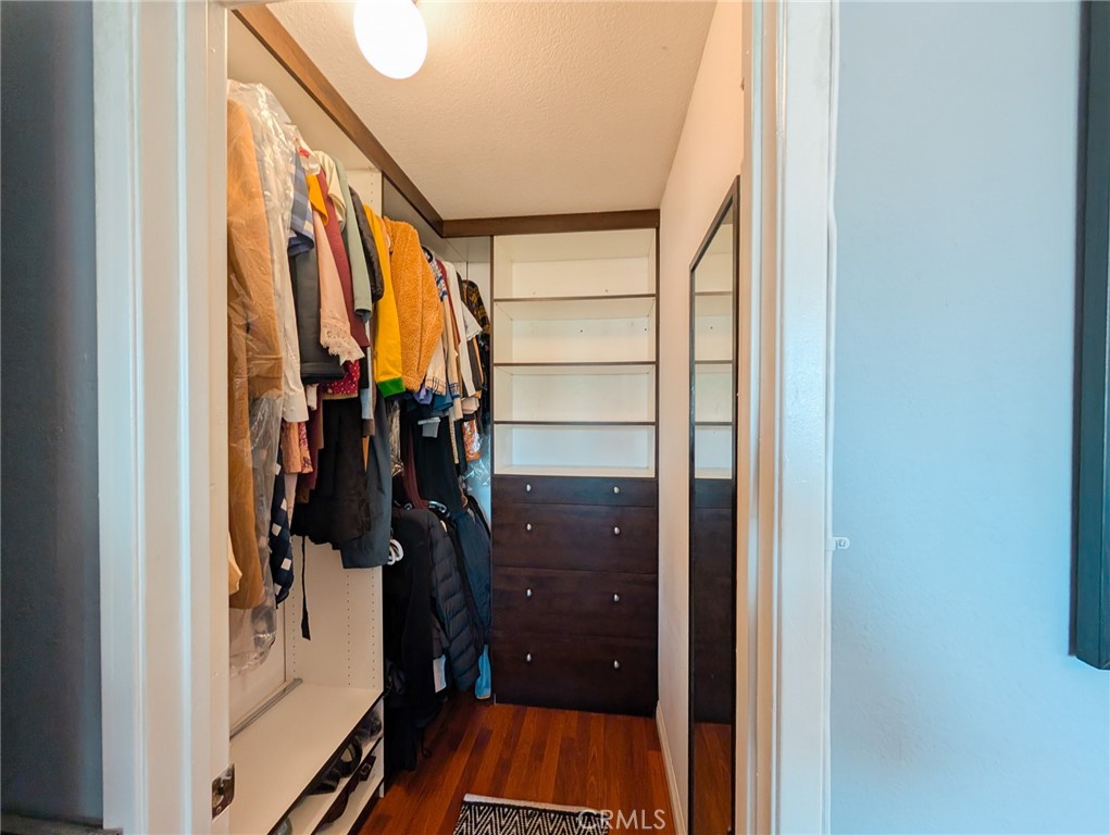 54 Oval Road, Unit 3 Irvine, CA 92604 - Photo 24 of 36 a view of walk in closet with clothes and shoes