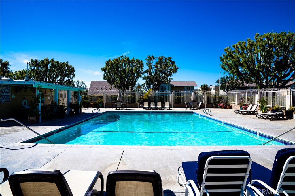 54 Oval Road, Unit 3 Irvine, CA 92604 - Photo 32 of 36 a view of a swimming pool with a patio