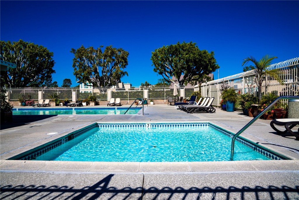 54 Oval Road, Unit 3 Irvine, CA 92604 - Photo 33 of 36 a view of a swimming pool with an outdoor seating