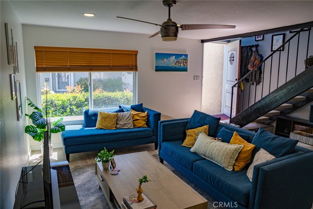 54 Oval Road, Unit 3 Irvine, CA 92604 - Photo 4 of 36 a living room with furniture and a potted plant