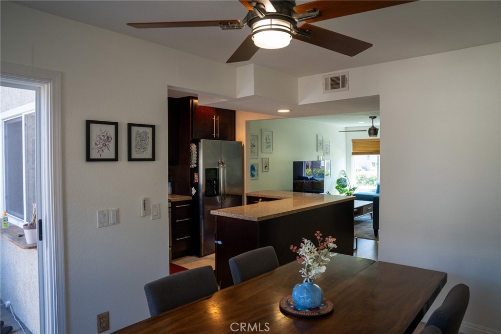 54 Oval Road, Unit 3 Irvine, CA 92604 - Photo 9 of 36 a dining room with furniture and wooden floor
