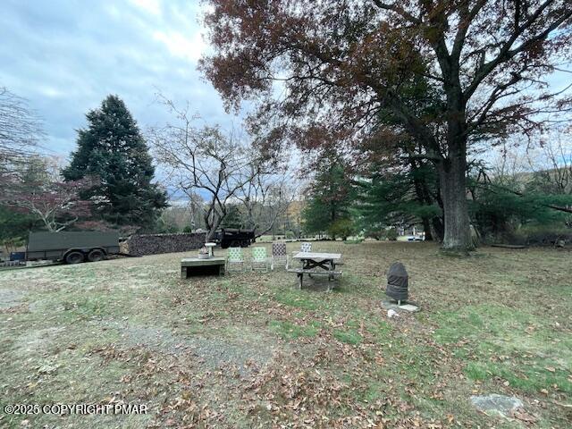 613 George Place Bushkill, PA 18324 - Photo 21 of 23 a backyard of a house with table and chairs