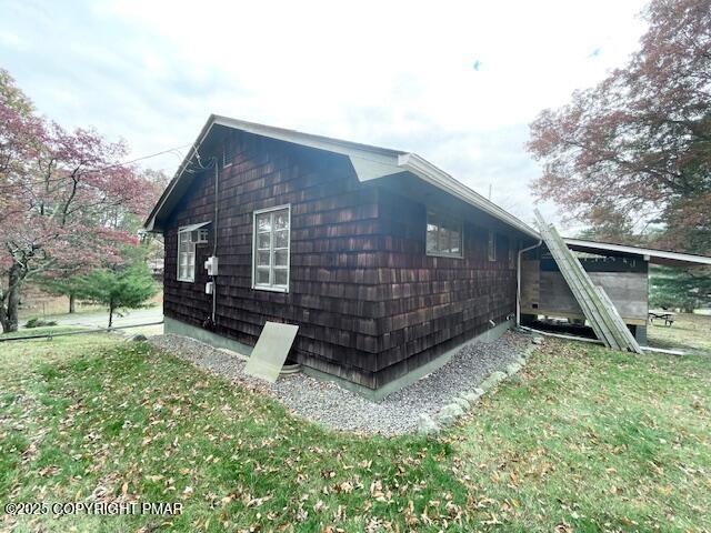 613 George Place Bushkill, PA 18324 - Photo 5 of 23 a view of backyard with wooden fence and a large tree