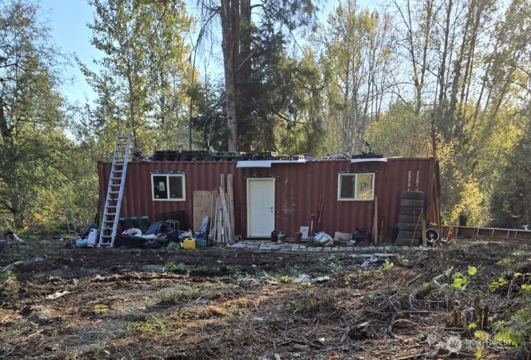 18820 220th Avenue Southeast Maple Valley, WA 98038 - Photo 5 of 16 a front view of house with yard and trees