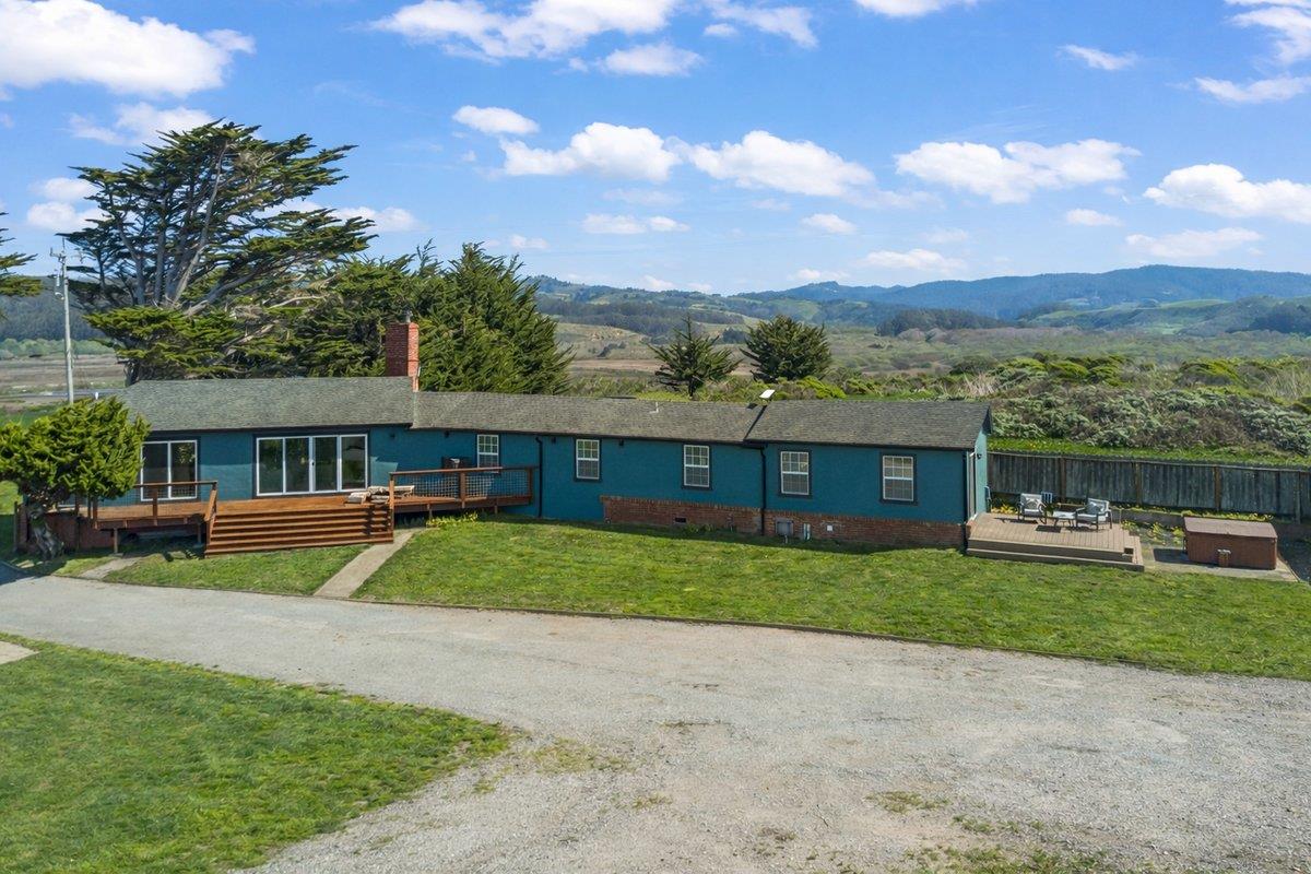 1263 Reservoir Road Pescadero, CA 94060 - Photo 13 of 75 a view of a house with a yard and sitting area